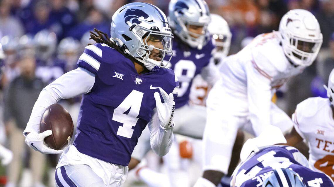 Kansas State wide receiver Malik Knowles (4) runs the ball against Texas during the first half of an NCAA college football game Saturday, Nov. 5, 2022, in Manhattan, Kan. (AP Photo/Reed Hoffmann)