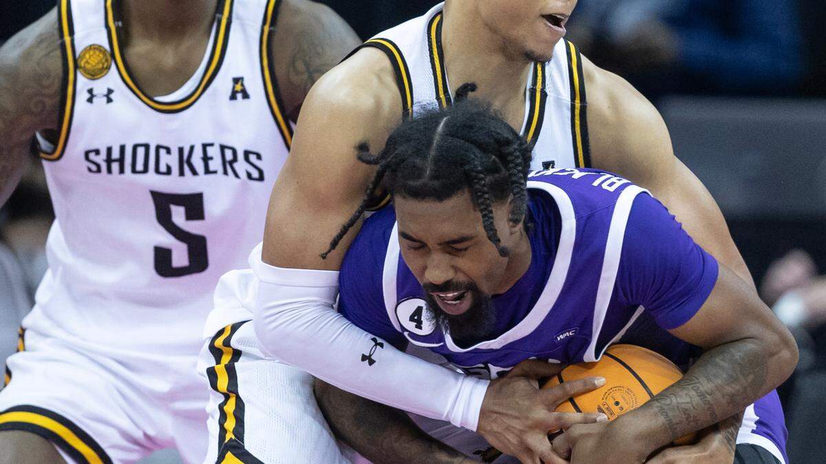 Wichita State’s Xavier Bell corrals Grand Canyon University’s Jovan Blacksher Jr. during the second half of their semi-final game of the Hall of Fame Classic in Kansas City on Monday.