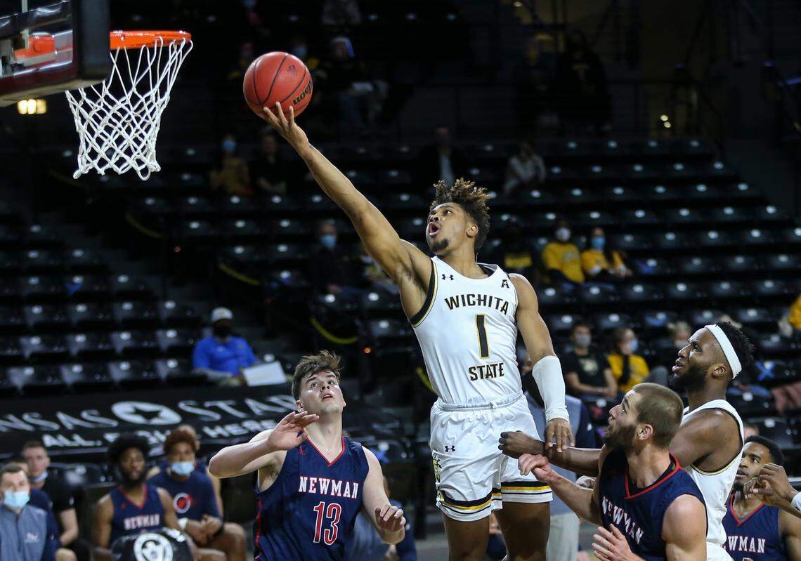 Wichita StateÕs Tyson Etienne shoots against Newman UniversityÕs Jorge Oliva during the first half on Wednesday at Koch Arena. The game was scheduled earlier this week when WSUÕs intended opponent, East Carolina, postponed dude to Covid-19 concerns.