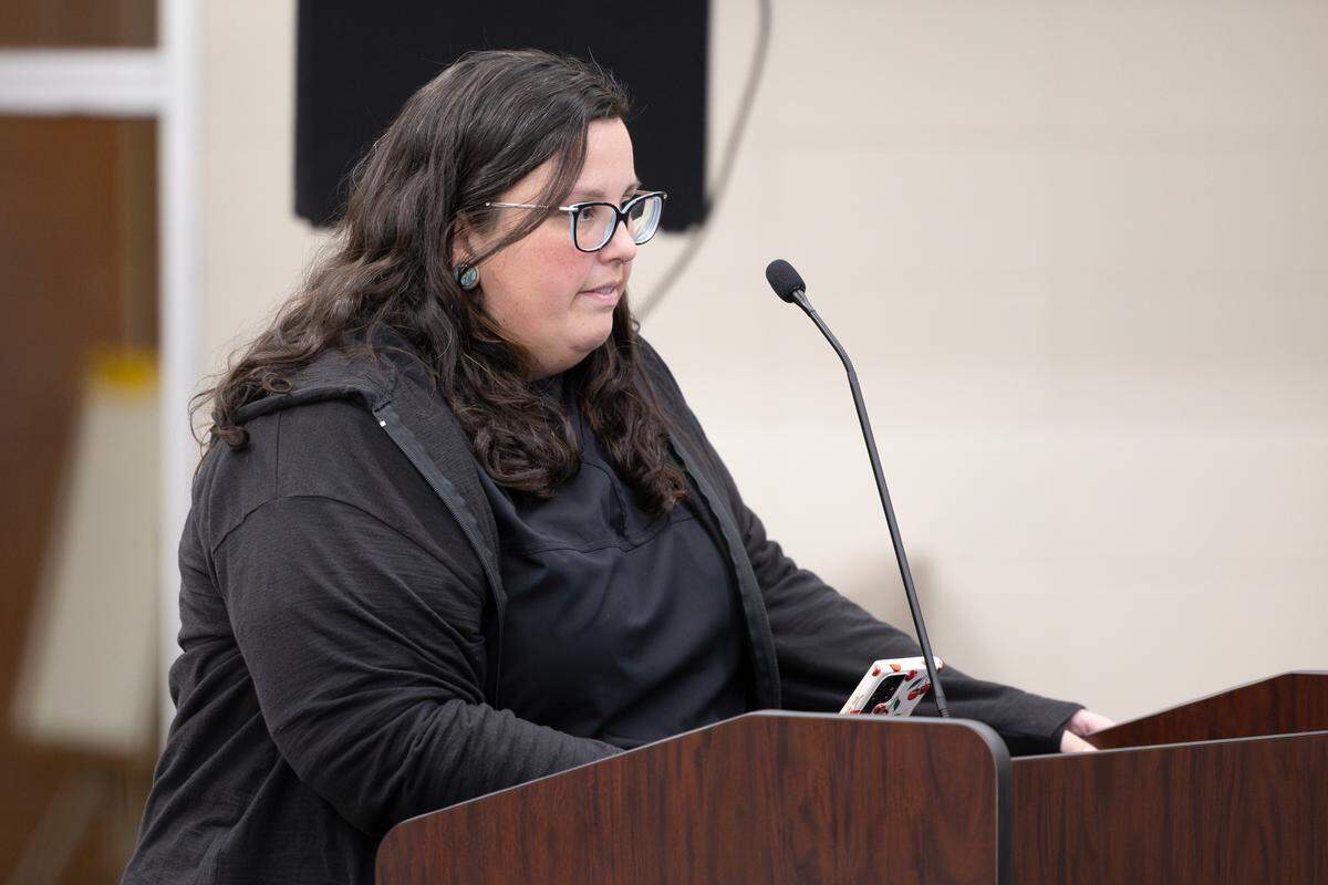 Megan Buettgenbach addresses the Wichita School Board on Thursday night during a meeting where members of the public voiced concerns they have regarding potential school closings.