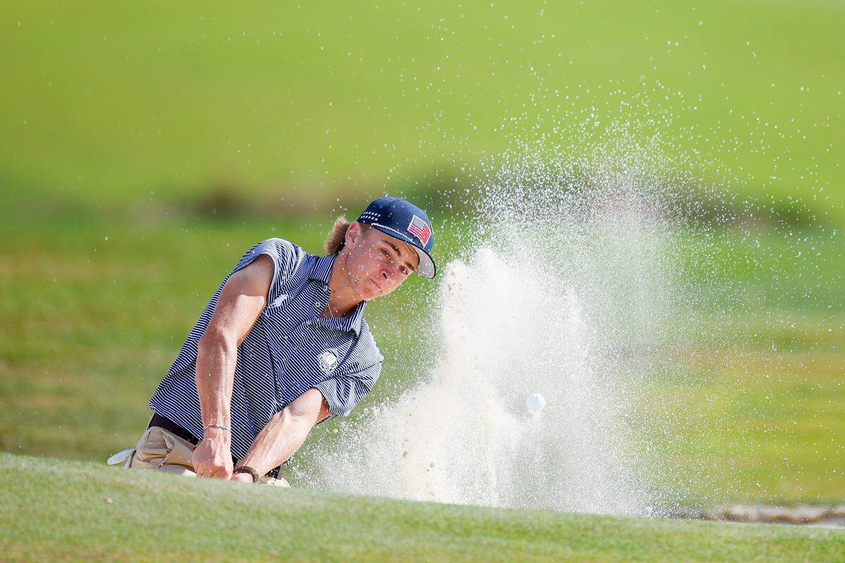 Collegiate junior Lunden Esterline hits out of a bunker on the sixth hole during the first round of the 2025 Junior Ryder Cup at Nassau Country Club on Tuesday.
