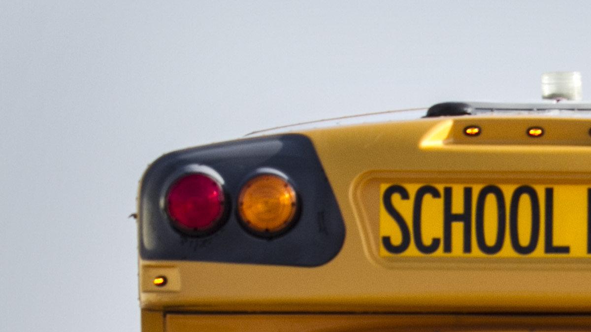 A driver drives a First Student school bus from the lot to the garage for a safety inspection. (July 31, 2014)