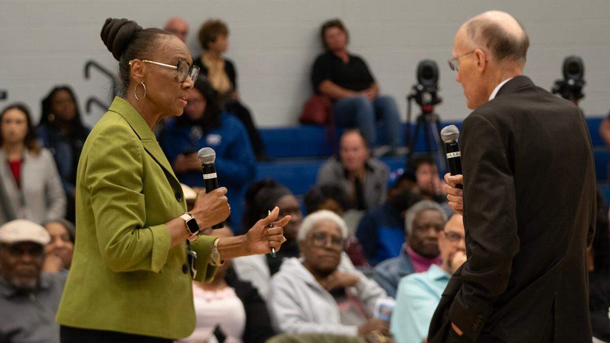 Former Wichita City Council member Lavonta Williams asks Dr. Garold Minns, Sedgwick County health officer, a question during a public meeting Friday night at the Boys and Girls Club, 2400 N. Opportunity Drive. The Kansas Department of Health and Environment held the meeting to discuss the 29th and Grove environmental site health study.