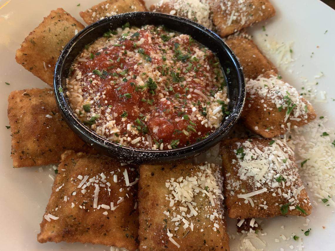 The toasted ravioli appetizer at The Old Spaghetti Factory comes with a side of marinara sauce topped with Mizithra cheese for dipping.