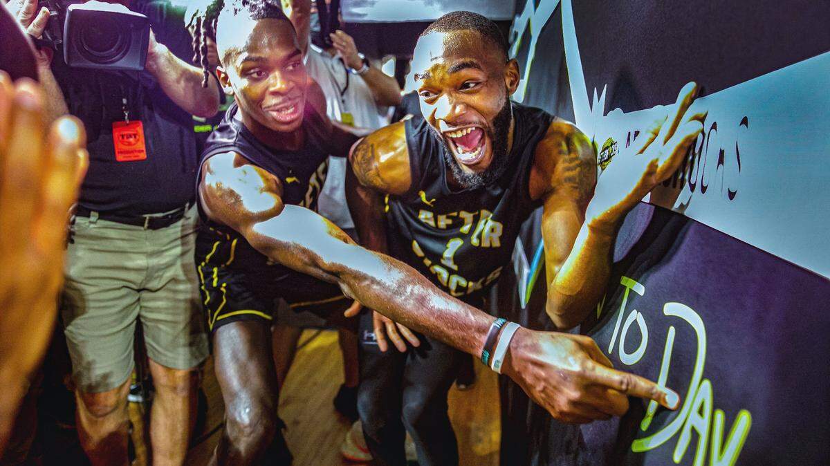 Markis McDuffie (right) and James Dickey (left) celebrate following the AfterShocks’ 74-67 win over Gutter Cat Gang to advance to the TBT semifinals in Dayton.
