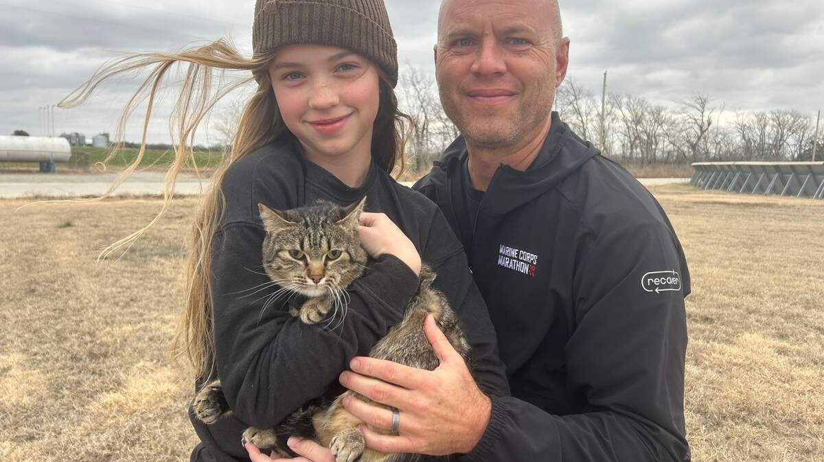 Greg Kalkwarf poses with his daughter, Teagan, and their cat, Piper, a 1-year-old tabby cat that Teagan is responsible for caring for. Piper won The Wichita Eagle’s cutest cat contest, where subscribers voted on more than 150 cats submitted by Eagle readers.