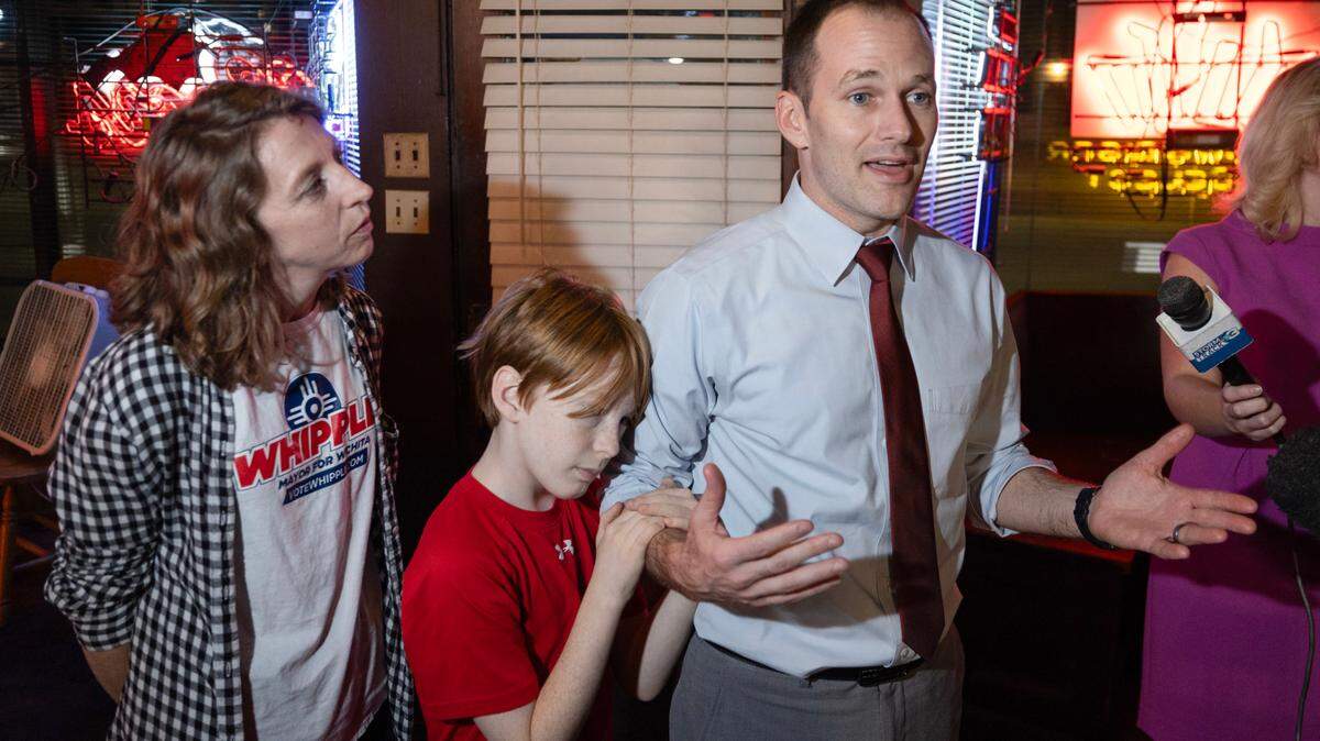 With his family by his side, Wichita mayor Brandon Whipple tells his supporters at Merle’s that things were not looking good after his opponent, Lily Wu, built a sizable lead against him Tuesday night. Whipple announced that he was headed home to get his two young sons to bed. Wu finished the night with 58% of the vote.