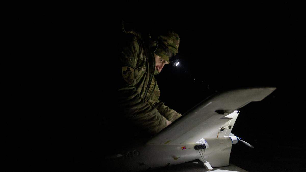 A Ukrainian serviceman of the 18th Sloviansk Brigade of the National Guard of Ukraine works on a drone interceptor in the Donetsk region on January 22, 2026, amid the Russian invasion of Ukraine. (Photo by Tetiana DZHAFAROVA / AFP via Getty Images)