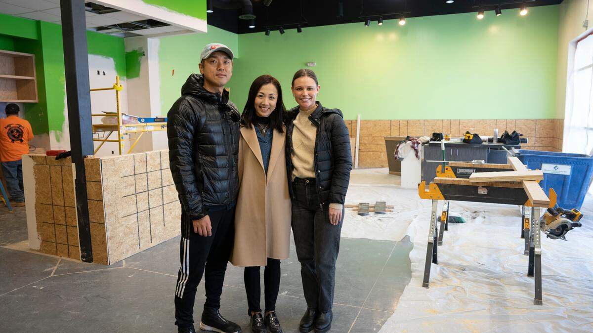Ninza Sushi owners Seong Han, far left, and Ada Yang, center, are renovating the former Viet Nom Nom spot on the southeast corner of 13th and Tyler. They will move Ninza from its current spot across the street to the renovated spot in the same plaza as Hurricane Sports Grill. At far right is Ninza’s general manager, Britteny Schmidt.