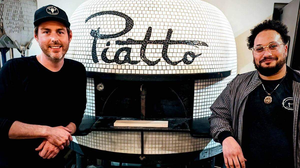 Pizza maker Julian Langston, right, who was on staff for at Piatto Neapolitan Pizzeria when it first opened, has returned, and owner Robert McMullin, left, is able to add Monday and Tuesday hours to the restaurant’s schedule.