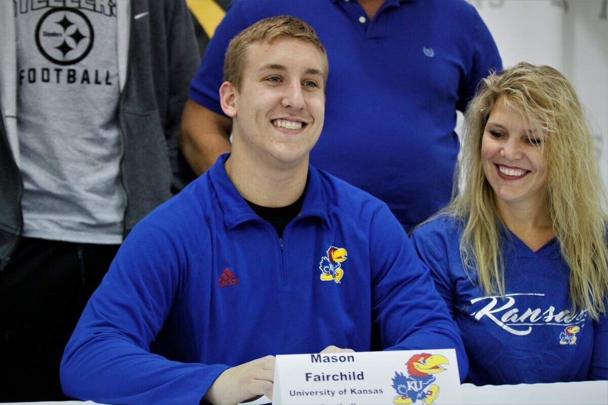 Andale tight end Mason Fairchild smiles for the cameras after signing with Kansas on National Signing Day on Wednesday. (Dec. 19, 2018)