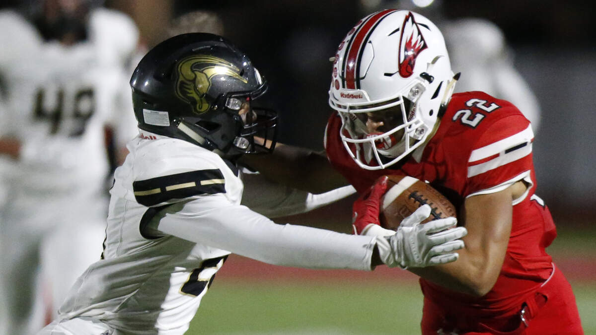 Maize wide receiver #22 Preven Christon pushes away Maize South defender #21 Trevion Mitchell on a long pass play. (November 2, 2018)