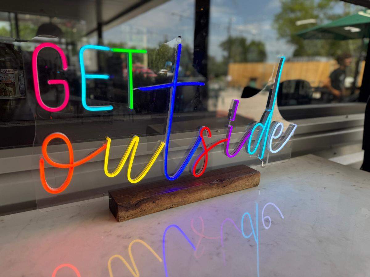 A neon sign posted in the patio area of Point Nine, a new Redbud Trail-adjacent restaurant in Andover