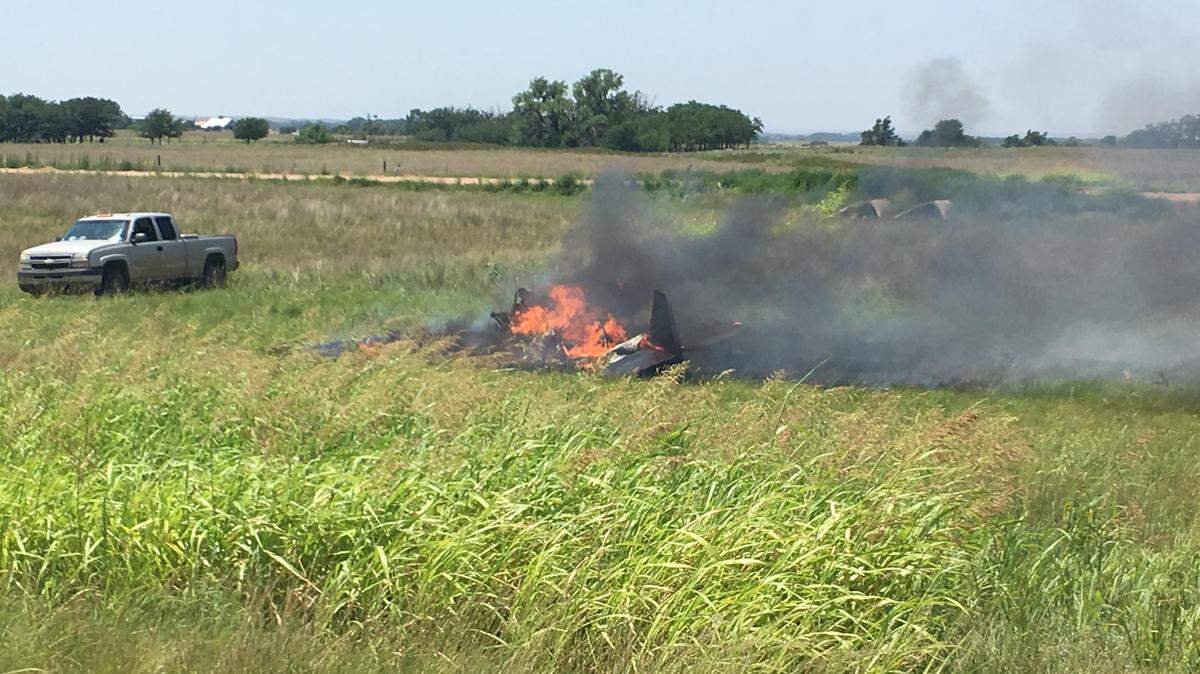 A single-engine plane was engulfed in flames after a wind gust caused it to crash while landing, the Kansas Highway Patrol says.