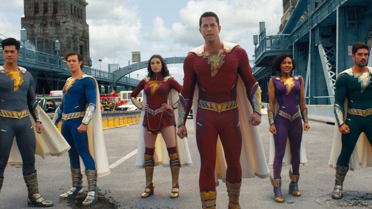 Oss Butler as Super Hero Eugene, Adam Brody as Super Hero Freddy, Grace Caroline Currey as Super Hero Mary, Zachary Levi as Shazam, Meagan Good as Super Hero Darla and D.J. Cotrona as Super Hero Pedro star in “Shazam! Fury of the Gods,” coming out on March 17.