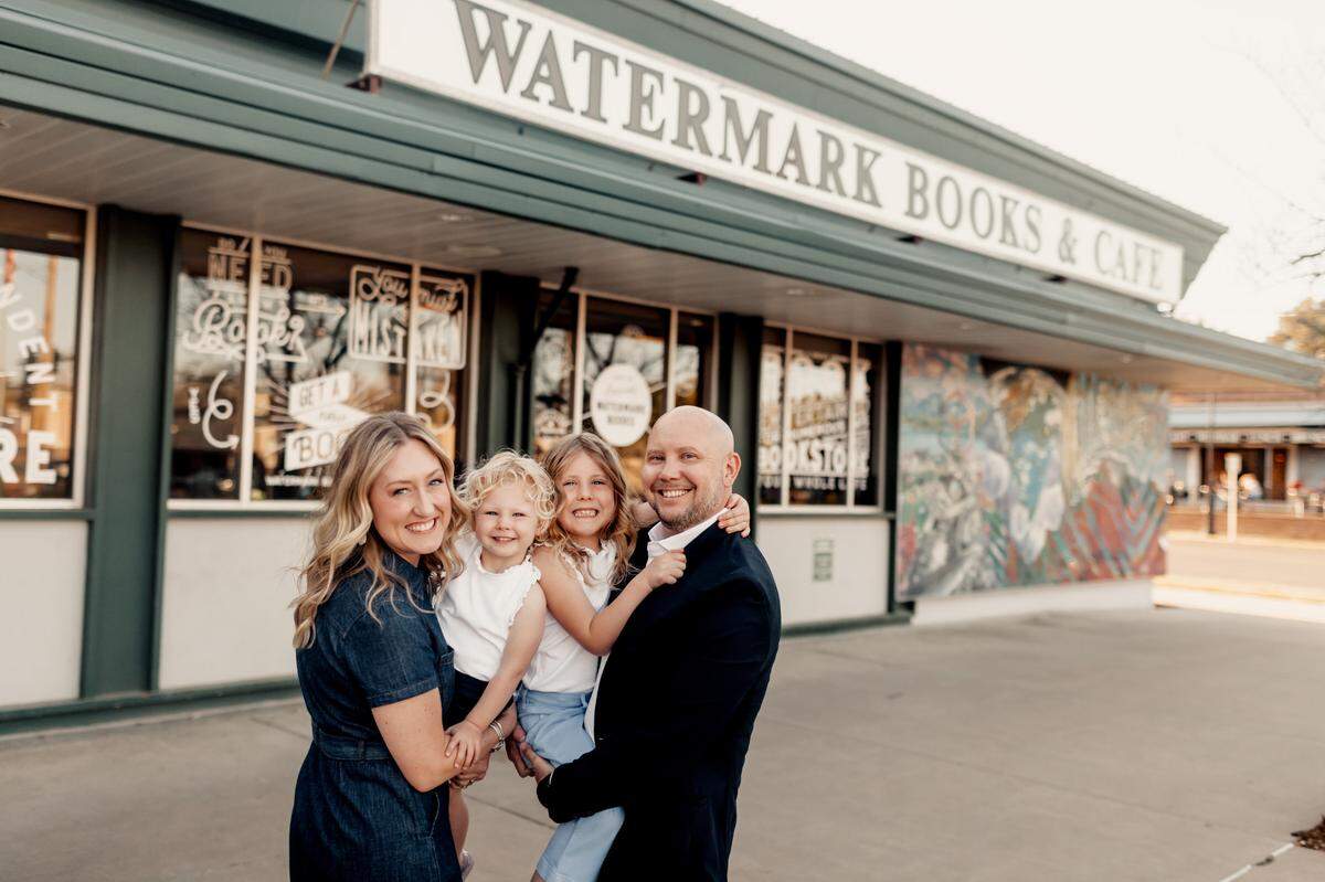 Erin and Ryan Potter, pictured with their daughters, Isabella, second from left, and Julia, purchased Watermark Books & Cafe in April.
