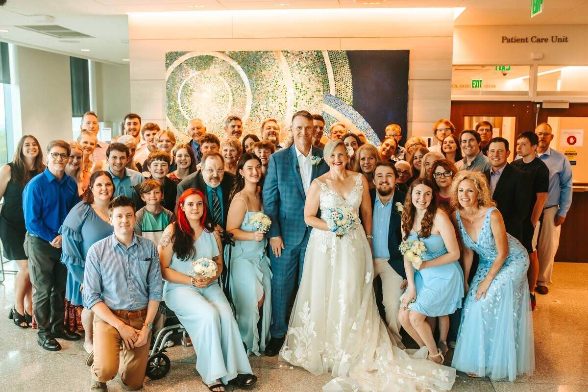Tracy Anderson and John Bartel pose for pictures after their wedding ceremony at KU Medical Center