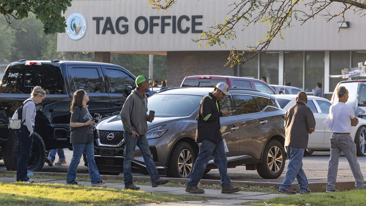 The line outside the Sedgwick County Tag Office at Douglas and Meridian wrapped around the parking lot before the office opened at 8 a.m. on Oct. 3, 2025.