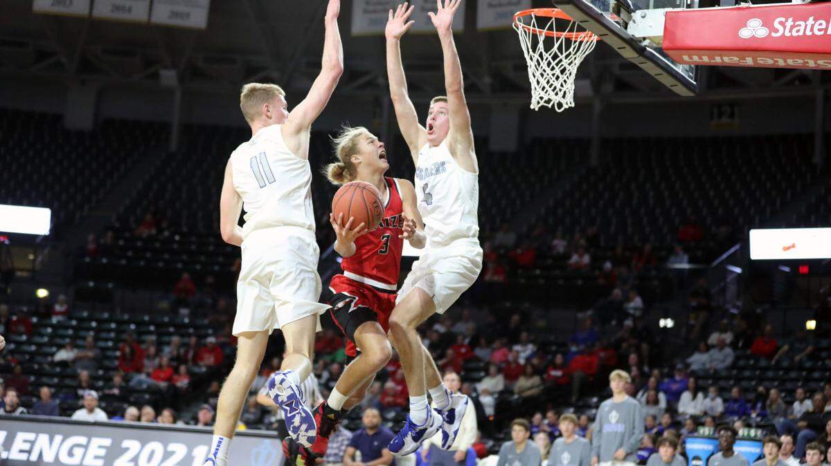 Maize junior Avery Johnson drives to the basket in the Eagle’s 48-43 win over Kapaun Mt. Carmel on Friday night in a Class 5A ranked showdown at Koch Arena.