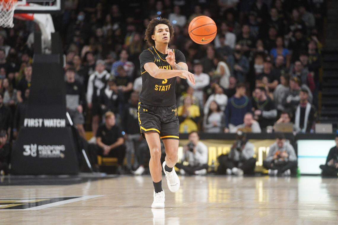 Wichita State point guard Craig Porter makes a pass during the first half of a road game at UCF on Tuesday night.