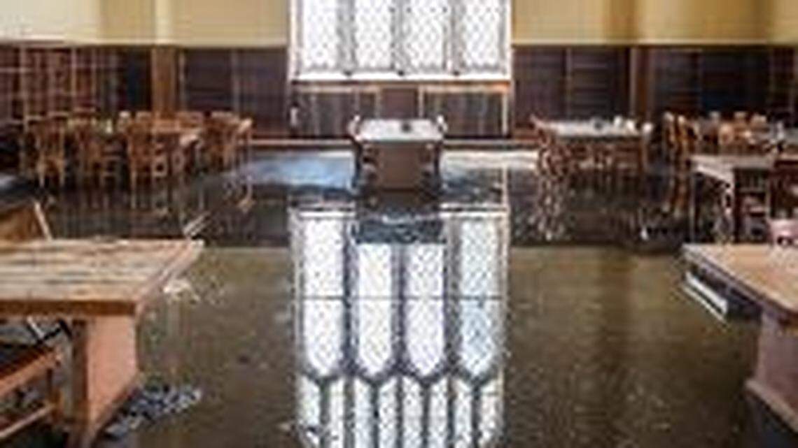 Tables in the "Great Room," with several inches of water on the floor on the west side.