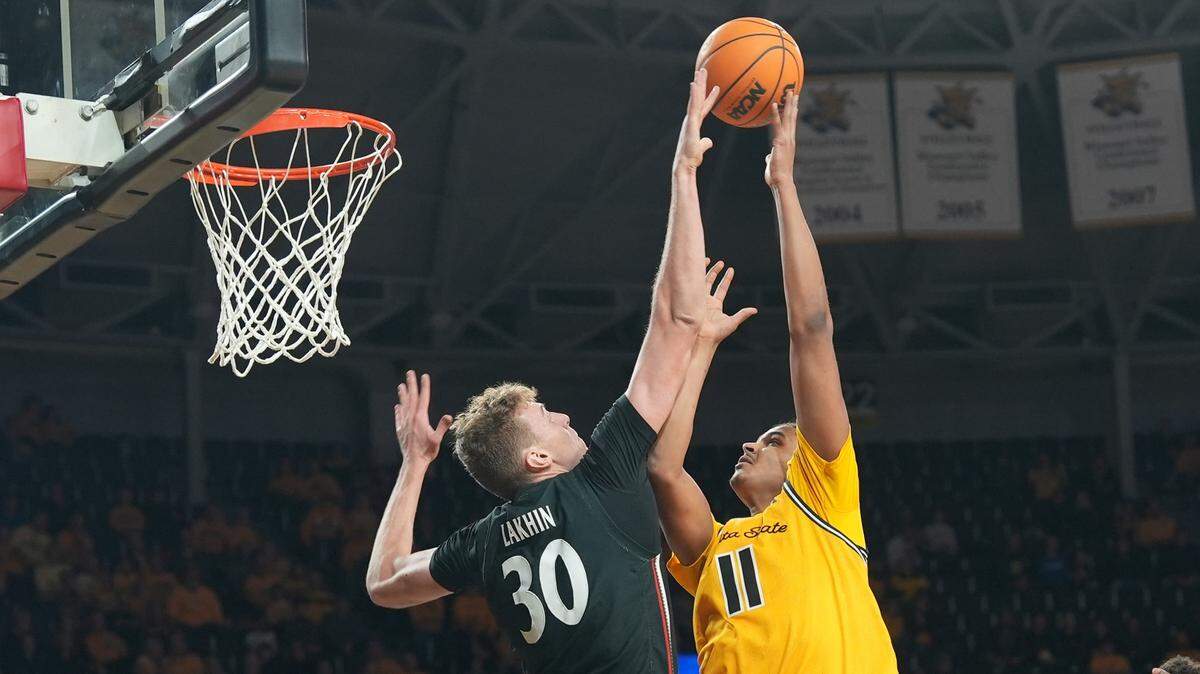 Cincinnati’s Viktor Lakhin blocks Wichita State’s Kenny Photos’ shot during the first half of their game at Charles Koch Arena.