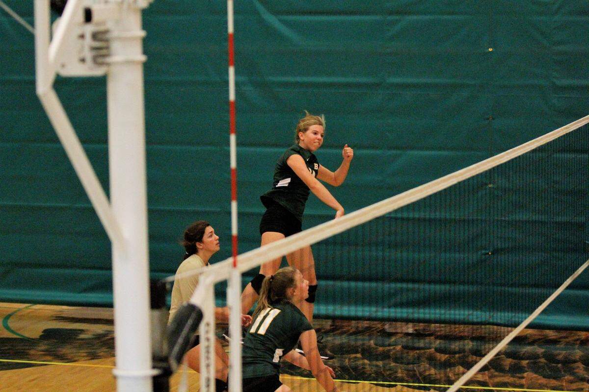 Carroll sophomore outside hitter Ella Larkin spikes the ball during the Golden Eagles’ triangular with Kapaun Mt. Carmel and Wichita East on Tuesday. (Sept. 4, 2018)