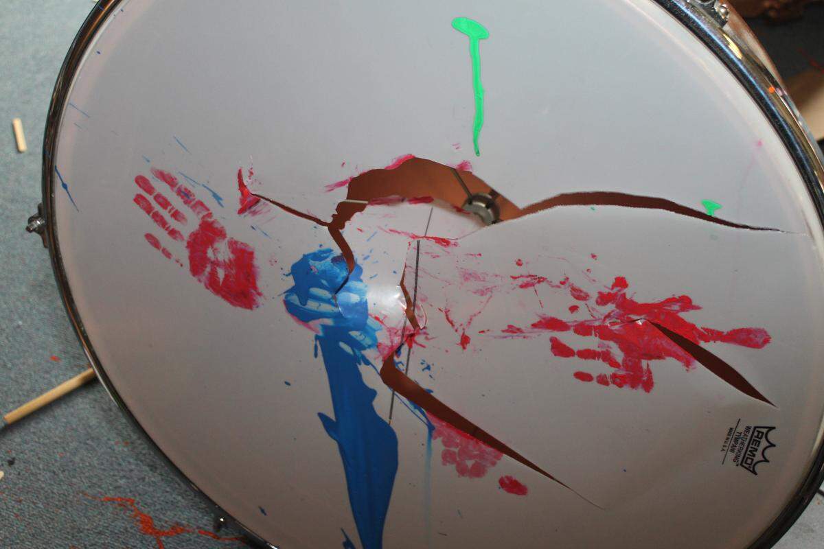 Vandals in the band room of Pretty Prairie High School punched holes in drum heads and left painted hand prints on them.