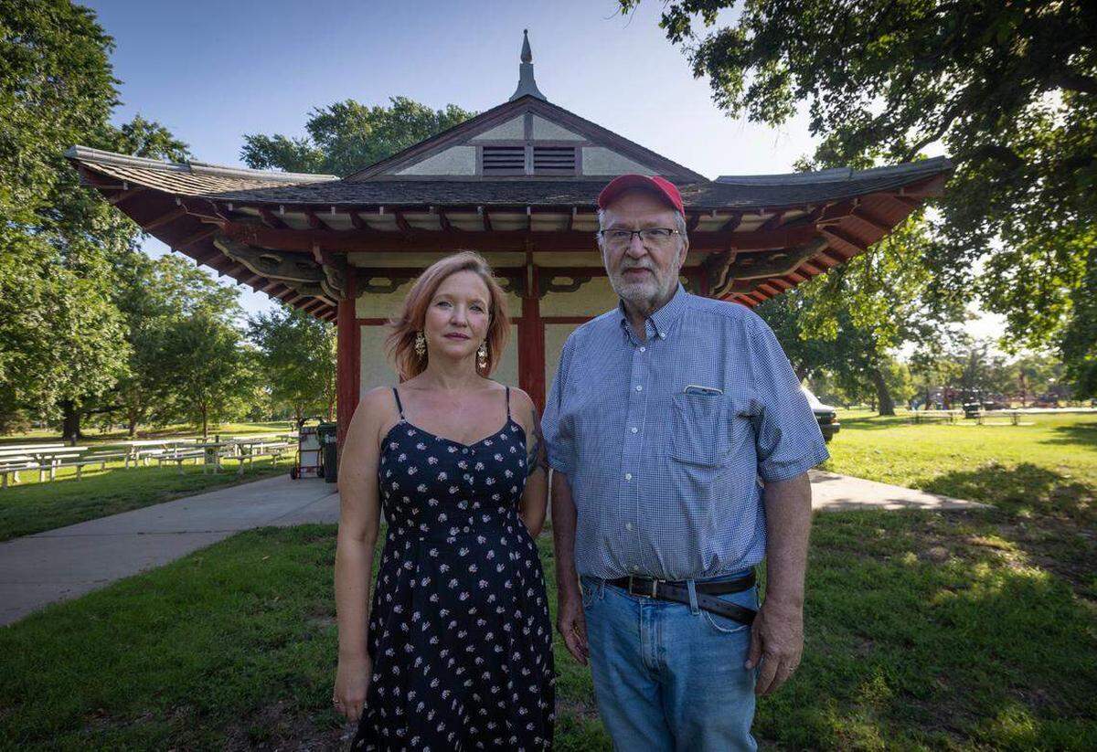 Zadi Owens, left, and former Lt. Gov. and Kansas Treasurer Lynn Rogers are leading an effort to restore this pagoda in Riverside Park. The structure was built in 1911 and served as a concessions stand. By this time next year, it should open as a wildlife classroom and event venue. Monday evening, the pagoda was vandalized, and the man who likes to protect it was attacked.