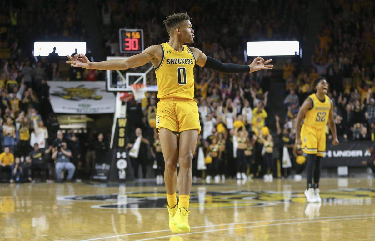 Wichita State’s Dexter Dennis celebrates a three-pointer against Texas Southern during the second half of their 69-63 win at Koch Arena on Saturday.