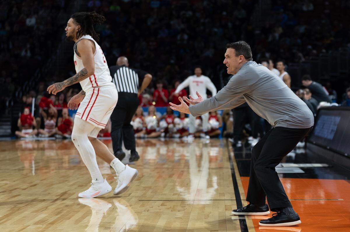 SIU-Edwardsville’s head coach Brian Baron communicates with his players from the sidelines in the first round of the 2025 NCAA Division I Men’s Basketball Championship against Houston.