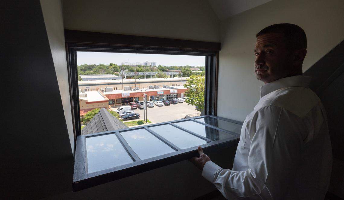 Pepin Suter looks out the very top window of the Sternberg Mansion, which he bought two years ago for $125,000. After an extensive remodel, the home will now be a sober living house.