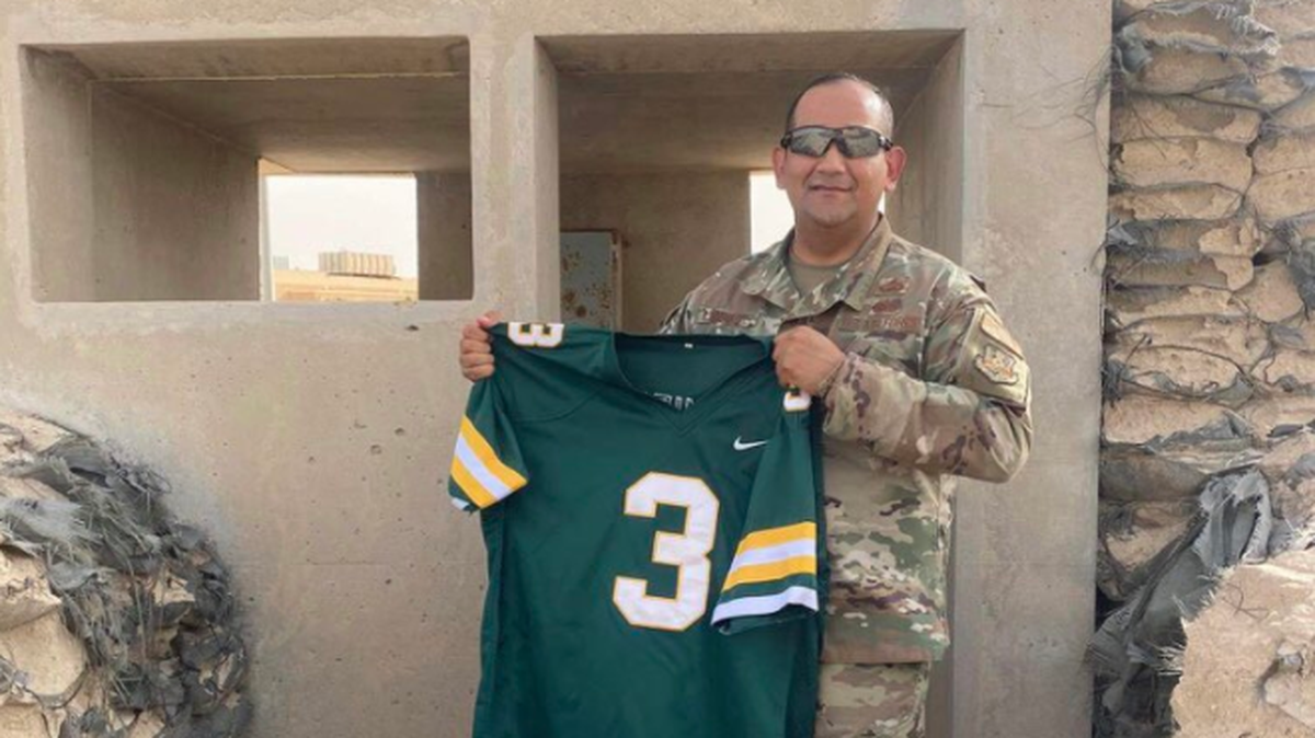 Derby senior Amare Ramirez’s father, Kelly, serving overseas hoists a Panthers uniform.
