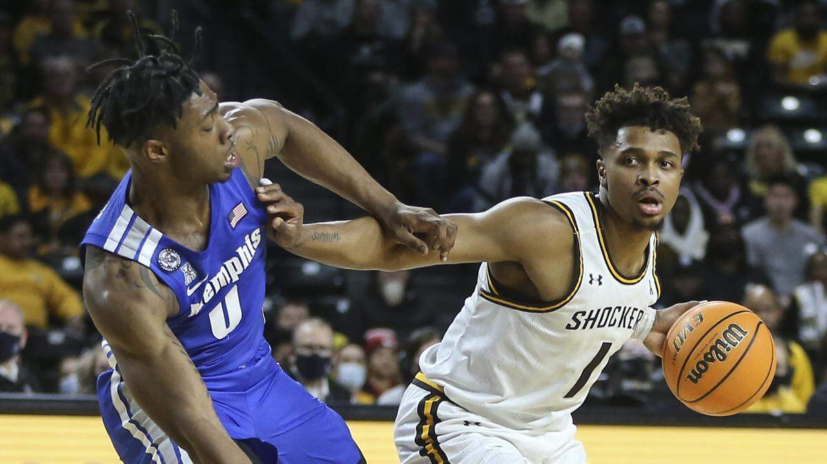 Wichita State guard Tyson Etienne was called for a foul for pushing off of Memphis guard Earl Timberlake during the first half on Saturday at Koch Arena.