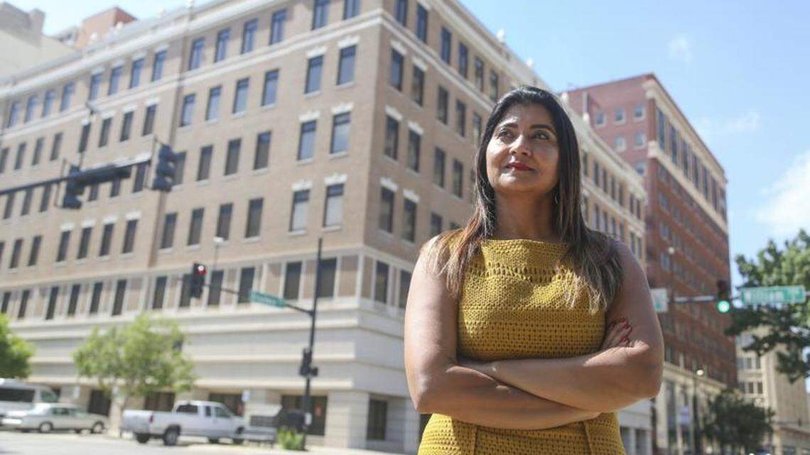 Sudha Tokala has decided to continue with her plans for the Kansas Health Science Center in downtown Wichita. That includes the conversion of the former Finney State Office Building, which is pictured immediately behind her, and Broadway Plaza behind that. Across the street, Tokala also owns the former Henry's building. Also not pictured is the nearby Sutton Place, the final building Tokala purchased.