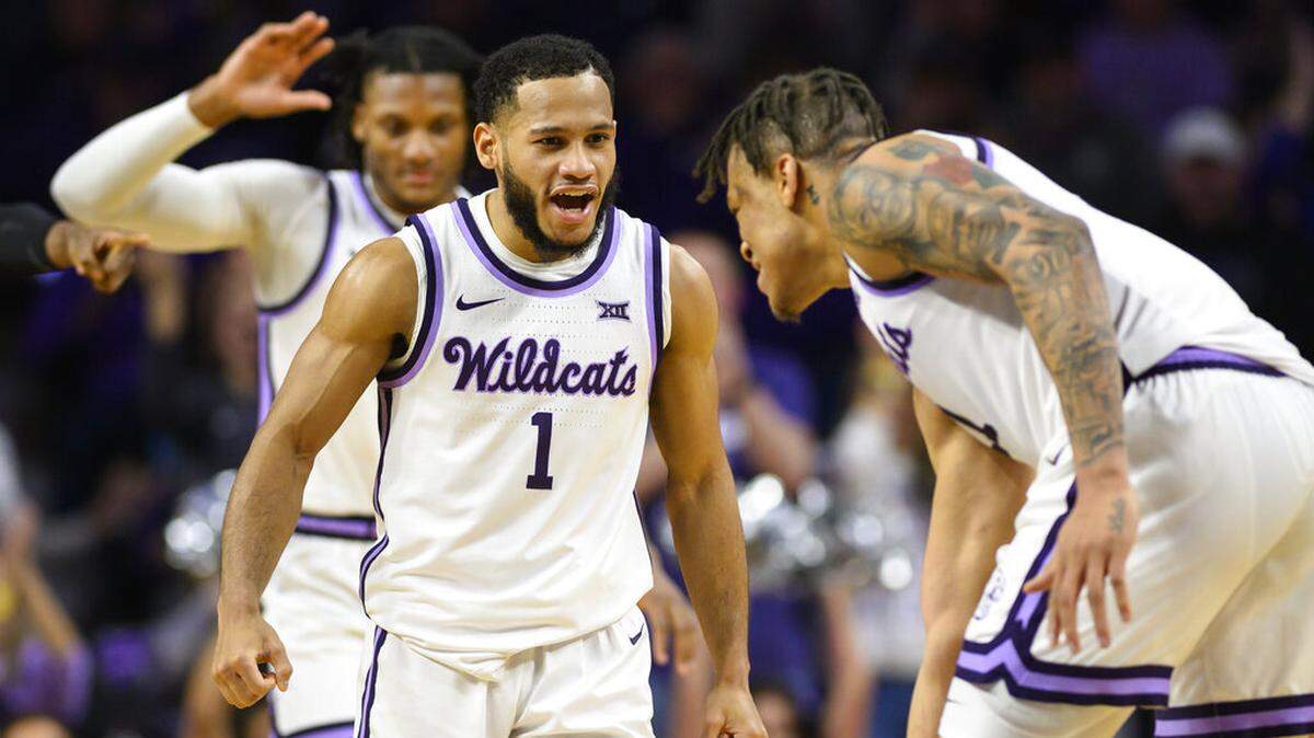 Kansas State guard Markquis Nowell (1) celebrates a play with Kansas State forward Keyontae Johnson, right, during the second half of an NCAA college basketball game against Oklahoma State in Manhattan, Kan., Tuesday, Jan. 10, 2023. (AP Photo/Reed Hoffmann)