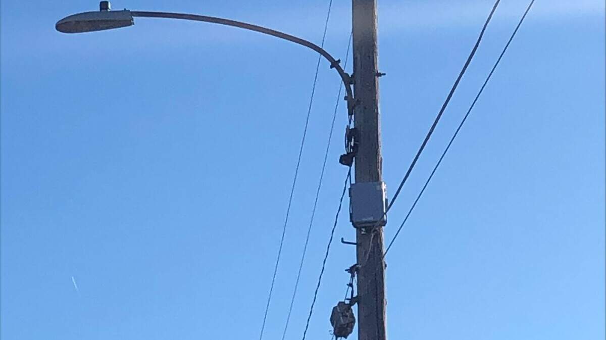 A gunshot sensor box, in a program piloted by the Wichita Police Department, hangs from a utility pole in the Hilltop area. Evergy has since taken down all the boxes.