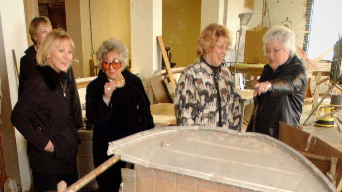 In this 2005 file photo, Women of Wichita members Ava Farid, in background, and, from left, Cindy Moehle, Helen Galloway, Janice Hanna and Sue Dower look over a 1931 Stearman Model 4-D at the Kansas Aviation Museum that they sponsored for renovation.