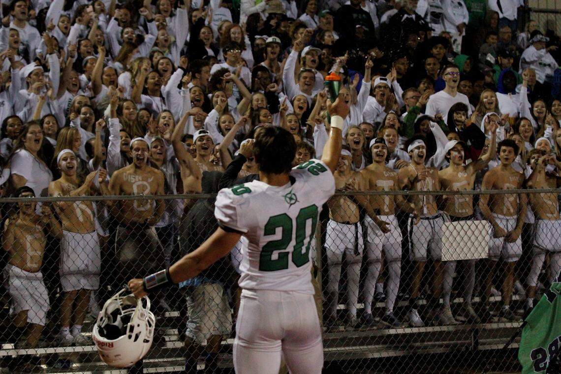Derby senior linebacker Cade Lindsey fires up the student section during the Panthers’ 24-6 win at Bishop Carroll on Friday night. (Sept. 21, 2018)
