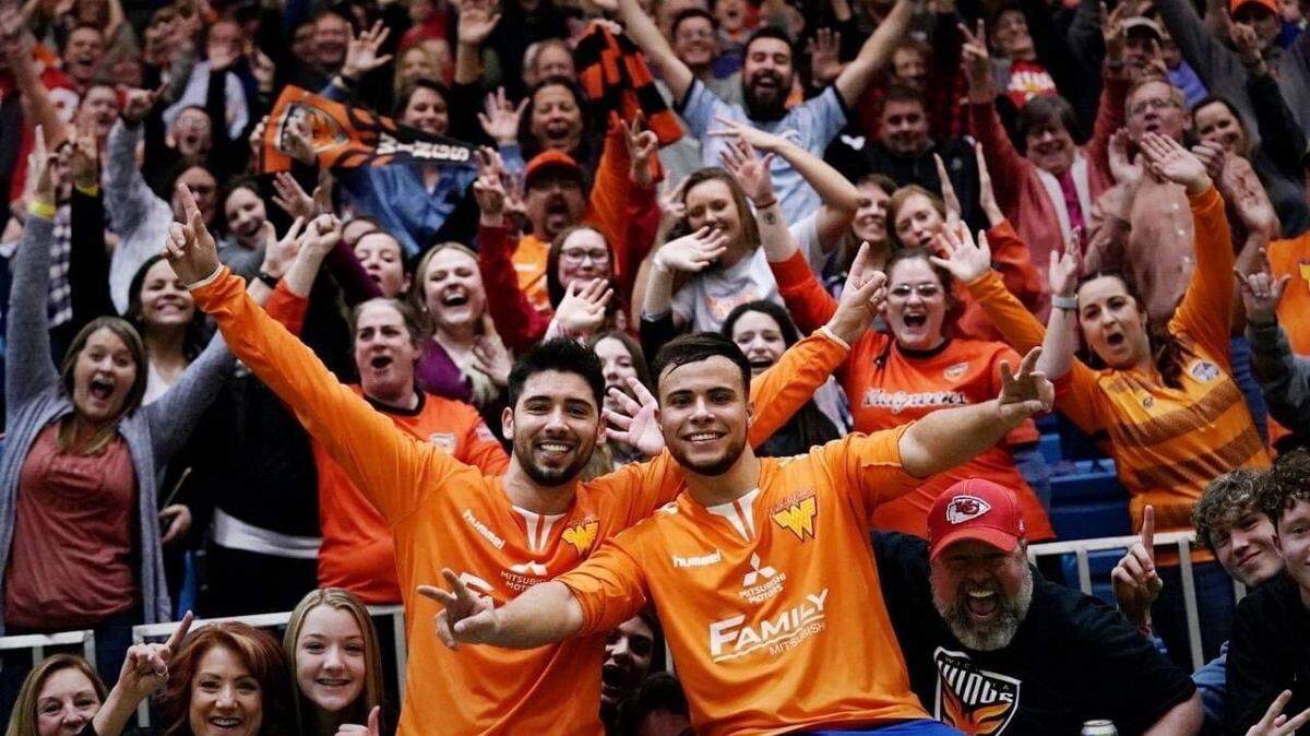 Wichita Wings players celebrate with fans during a season when they won the regular season title in the Major Arena Soccer League 2.