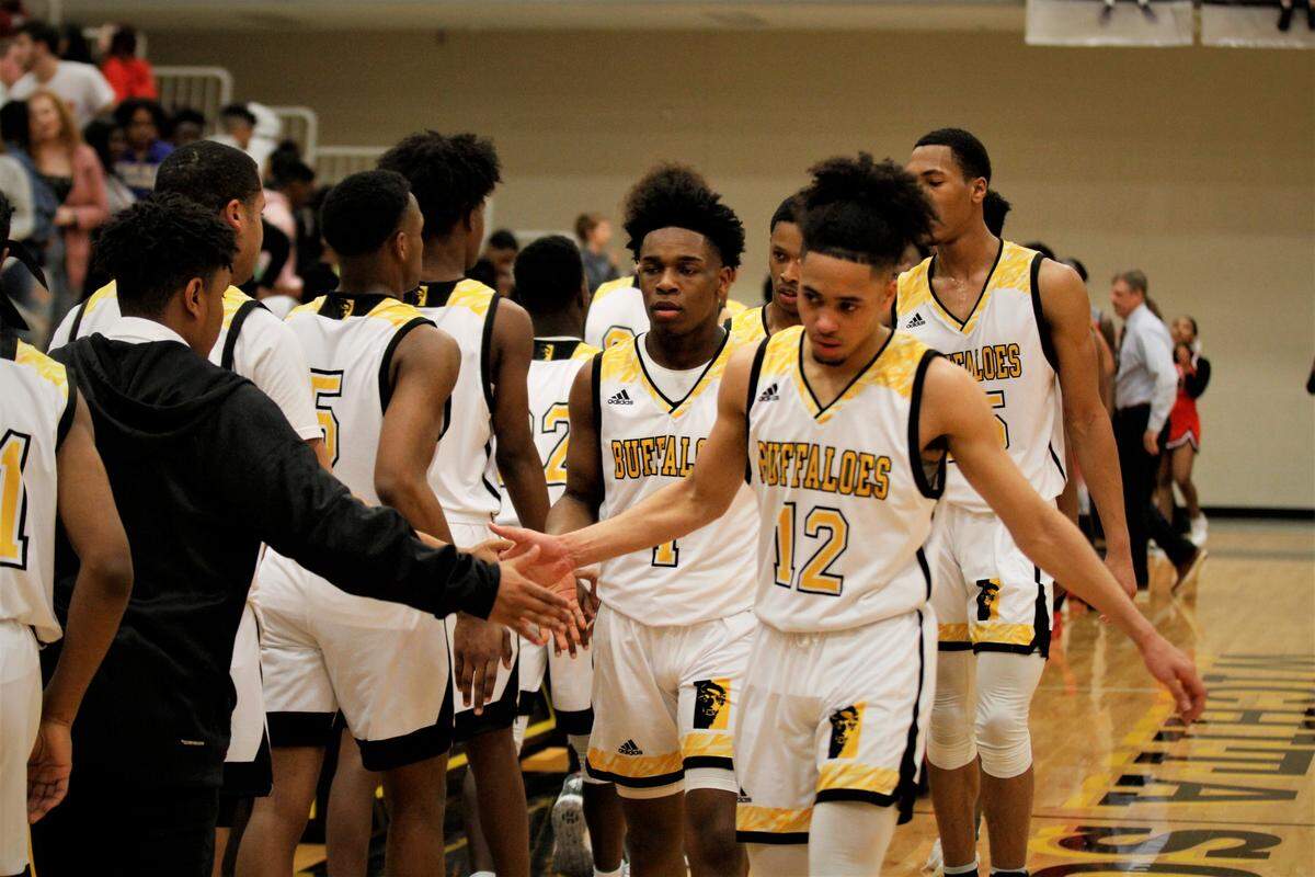 Wichita Southeast’s Jackie Johnson (left), Johnny Murdock (center) and Breelyn Wright (right) were key to the Golden Buffaloes’ 72-64 home win over Heights on Tuesday night. (Feb. 12, 2019)