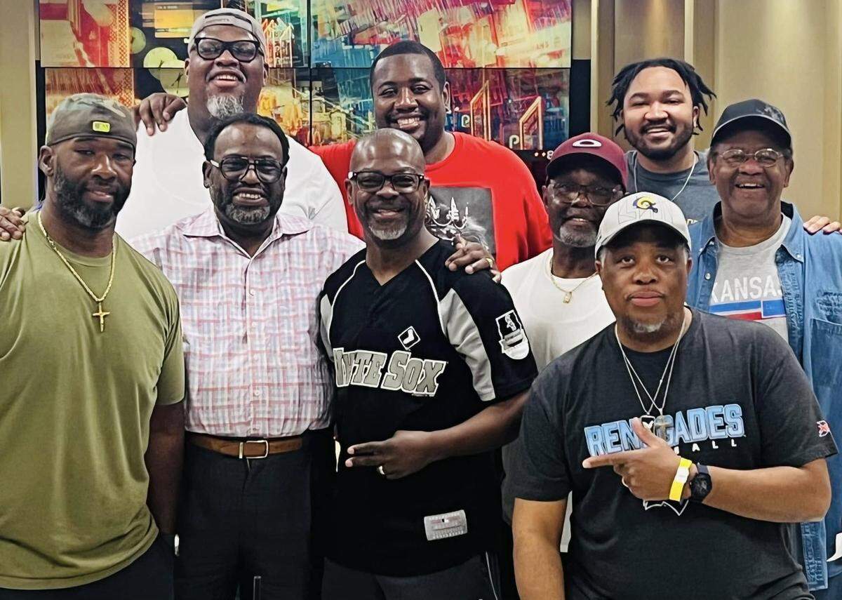 Bishop Mark Gilkey, second from left on the front row, is fondly remembered as a people person who loved everyone unconditionally. He’s shown here with a men’s fellowship group.