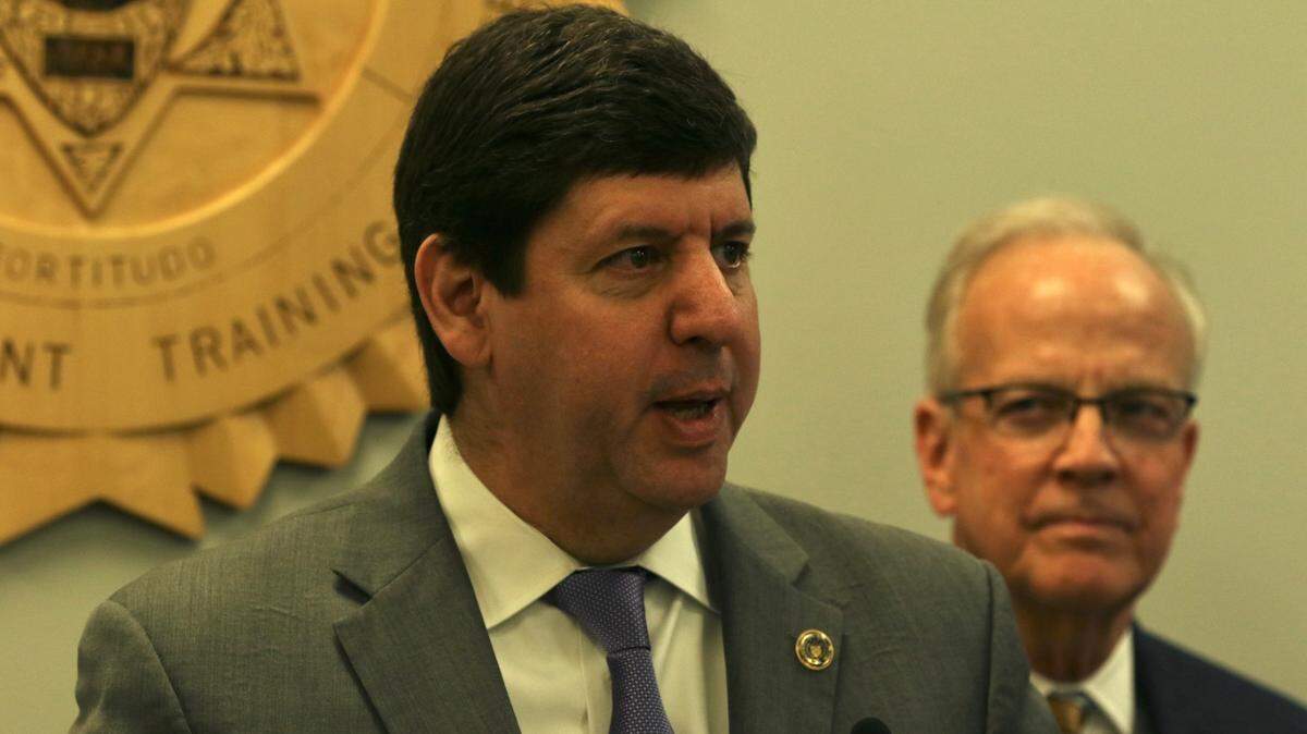 ATF director Steven Dettelbach, flanked by U.S. Sen. Jerry Moran, announces the federal agency’s partnership with Wichita State University and the construciton of a new lab on the school’s Innovation Campus.