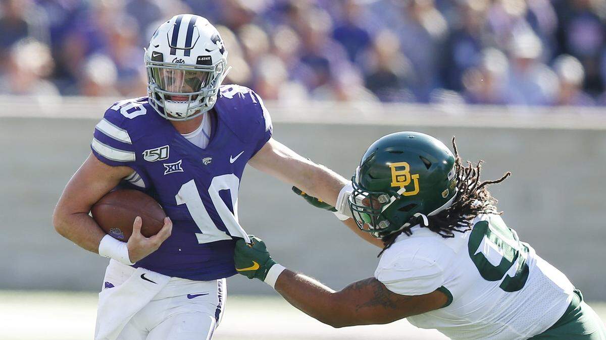 Baylor defensive tackle Bravvion Roy (99) gets K-State quarterback Skylar Thompson (10) by the jersey Saturday afternoon in the 2nd quarter in Manhattan.(October 5, 2019)