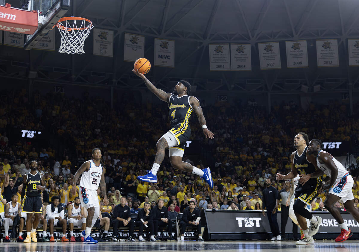 Marcus Keene sails for a layup during the first half against Eberlein Drive on Sunday at Koch Arena.