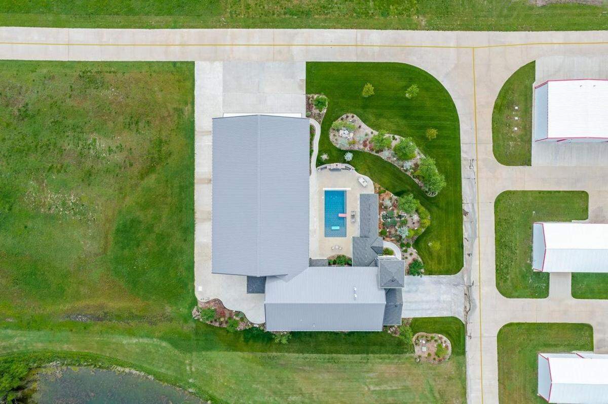 An aerial view of 7053 S. 143rd St, E. shows the property’s layout.