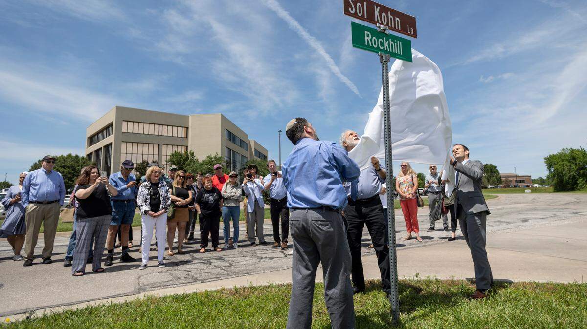Rabbi Andrew Pepperstone, left, Rabbi Michael Davis, middle, and Wichita mayor Brandon Whipple unveil a new street sign honoring Sol H. Kohn near the Jewish Community Center at 1850 N. Woodlawn on Wednesday. Kohn served five months as Wichita mayor in 1879 and had a big impact on Wichita’s early growth. He was the city’s first Jewish mayor.