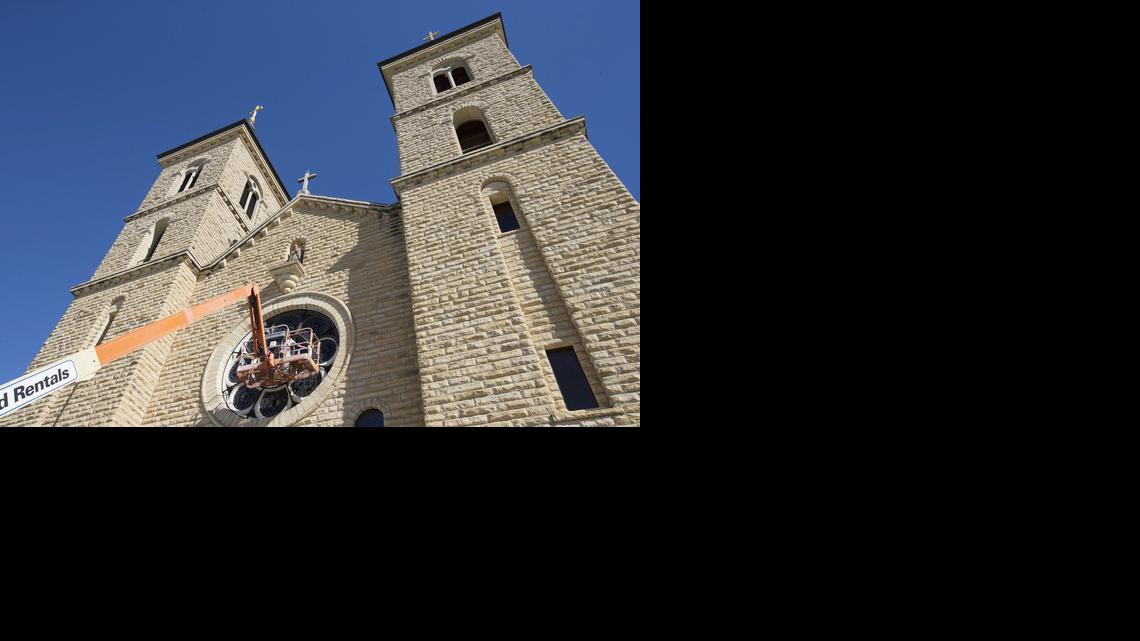 Sean Hilburn does restoration work on the stained-glass windows of St. Fidelis Catholic Church in Victoria.