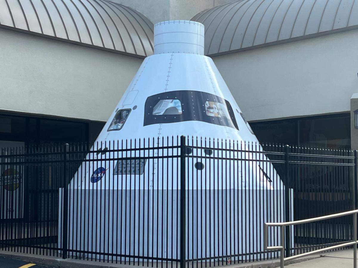 This replica of a space capsule that sits in front of the new, long-anticipated Space Discovery Institute, is an indication that there’s a nontypical business in the Andover Square center where it sits.