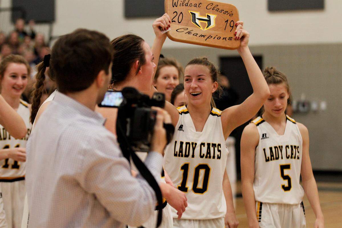 Haven senior guard Arie Roper hoists the plaque after winning the 2019 Wildcat Classic with a 54-40 victory over Cheney on Saturday. (Jan. 26, 2019)
